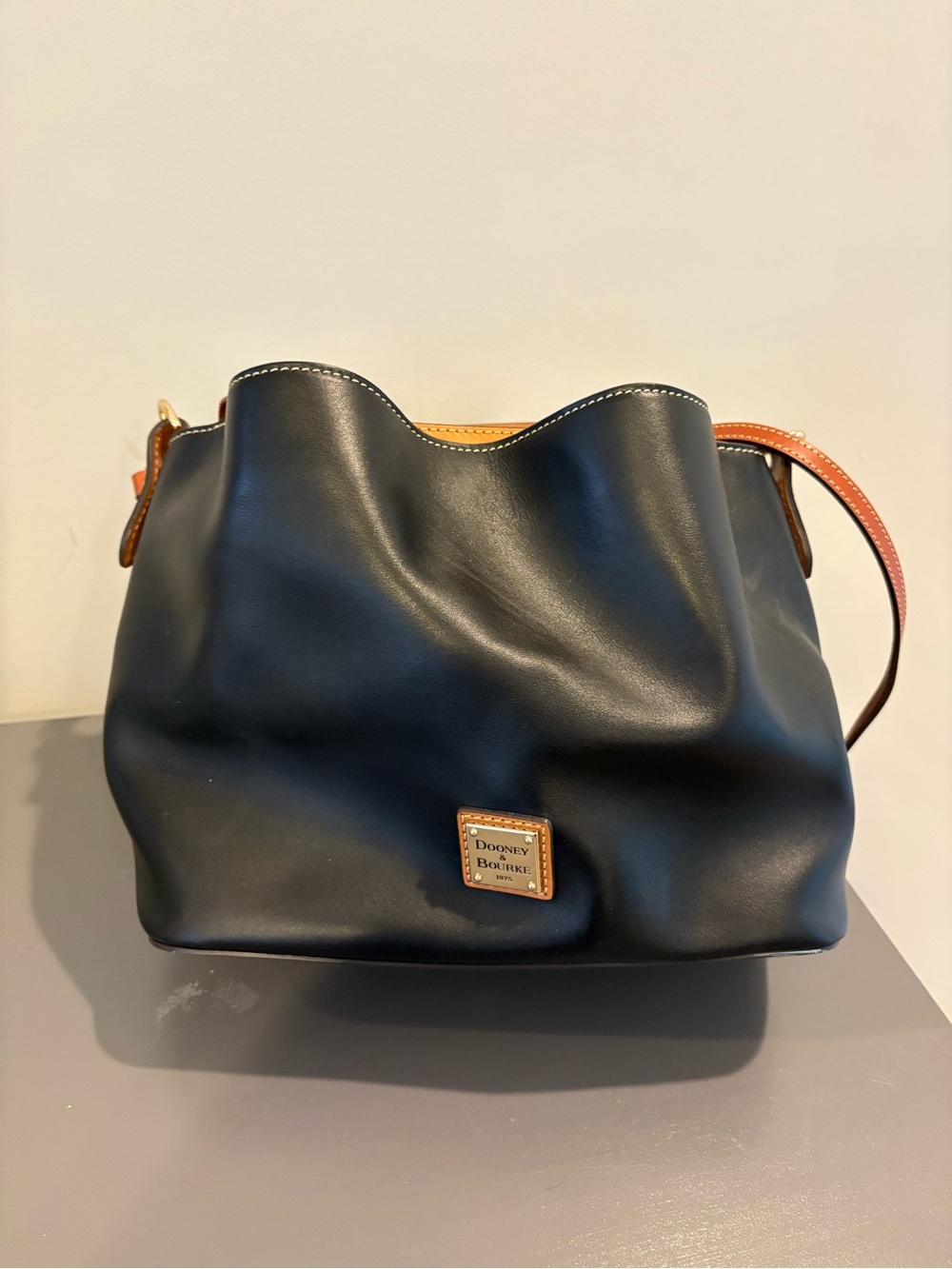Dooney & Bourke Black Leather Shoulder Bag with Brown Trim and Tan Accent